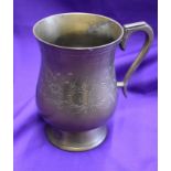 An engraved metal mug presented to a Manchester United player after the match between Shamrock