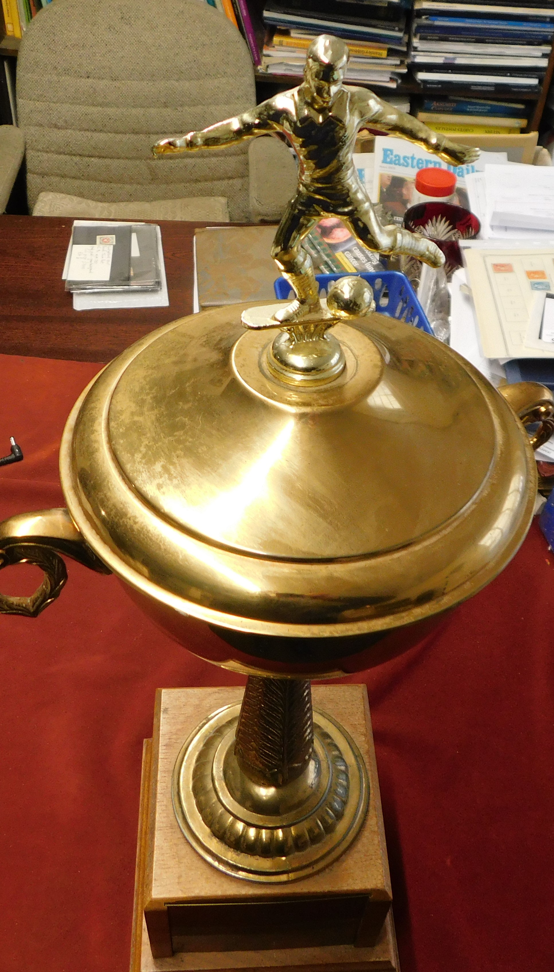 A brass trophy presented to Willie Morgan former Burnley and Manchester United winger. The trophy