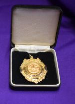 Winners medal with the original box awarded to Manchester United in the friendly match in Bahrain