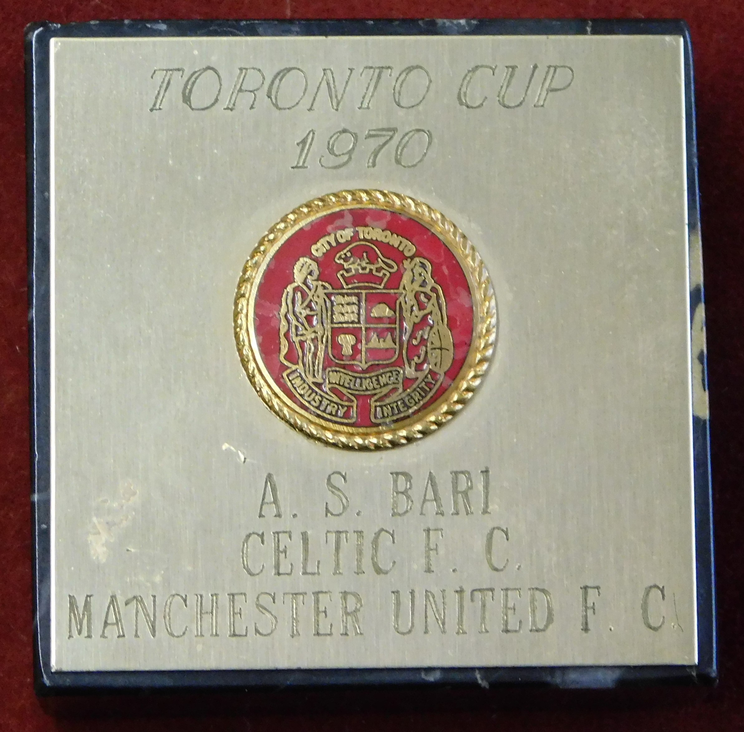 A small onyx paperweight engraved with "Toronto Cup 1970 AS Bari Celtic Manchester United." This was