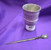 An engraved small pewter beaker possibly used for alcoholic measurements presented to Manchester