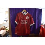 Unframed Manchester Utd shirt, 2006-2007 signed on front by Wayne Rooney, (the shirt is a number 4