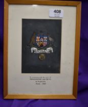 A framed Australian shirt badge 26cms x 21cms commemorating the Manchester United tour to