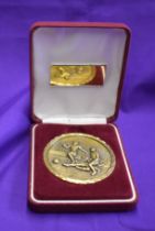 A player medal in a box with "The Amsterdam Tournament 2002 Finalist" separately inscribed presente