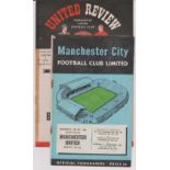 Two programmes featuring Manchester United and Manchester City. Friendly at Old Trafford 23rd