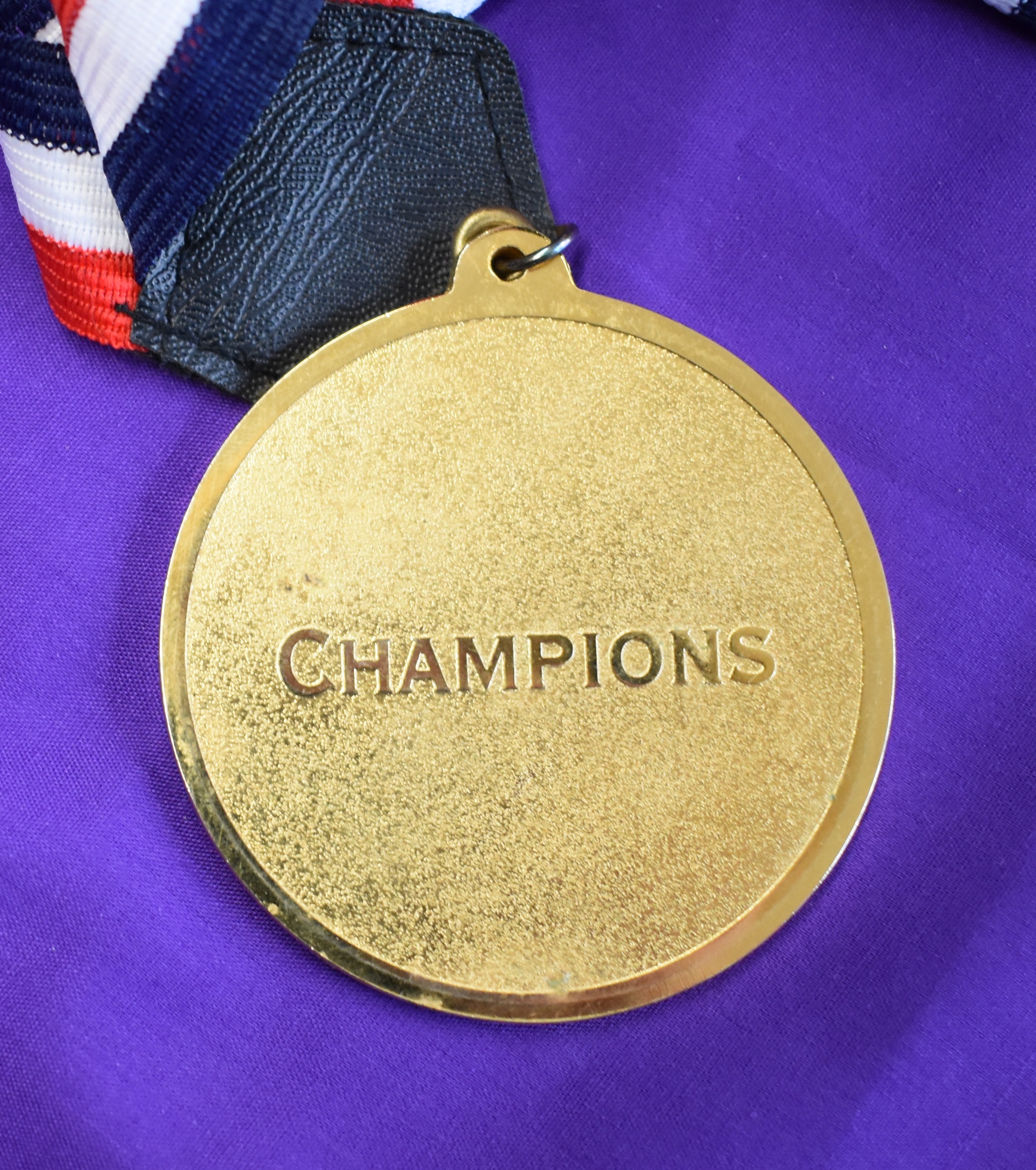 An engraved medal with red white and black ribbon presented to a Manchester United player on July - Image 2 of 2