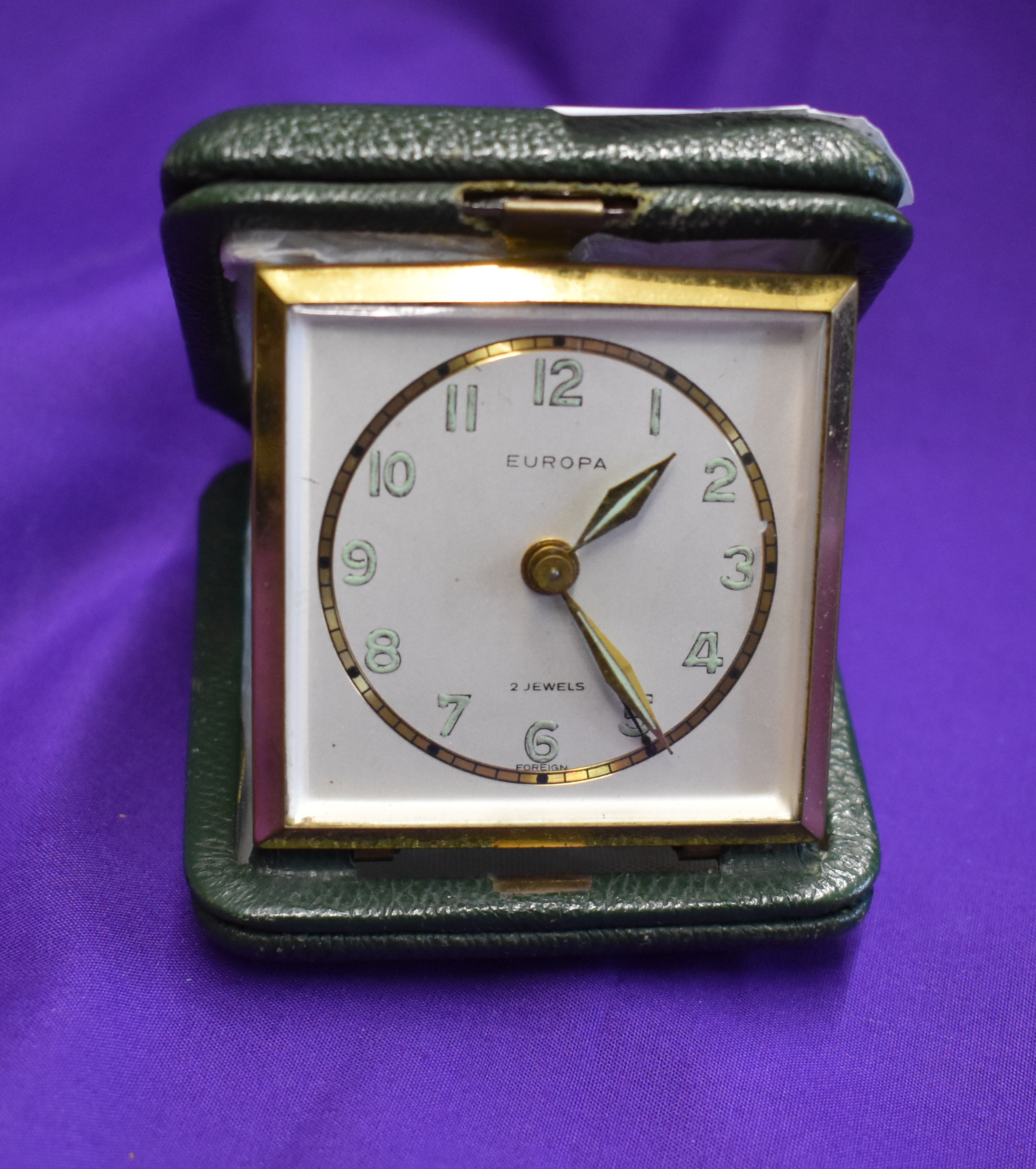 A lighter and alarm clock in an engraved box presented to a Manchester United player following