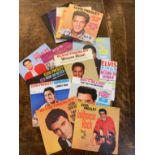 SIXTEEN ELVIS PRESLEY SINGLES IN MINT CONDITION A collection of sixteen 7" 45rpm singles by Elvis
