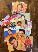 SIXTEEN ELVIS PRESLEY SINGLES IN MINT CONDITION A collection of sixteen 7" 45rpm singles by Elvis