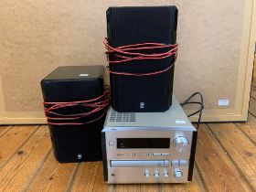 YAMAHA CD PLAYER AND TUNER. A Yamaha CRX-E 150 CD receiver designed for car audio applications.