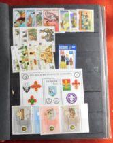 Scouting - A stockbook of mostly 1980s Scout mint sets and miniature sheets. A very good lot with