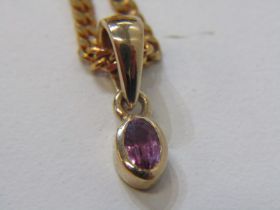 RUBY PENDANT ON 9CT CHAIN, oval ruby pendant in 9ct gold mount on a 22inc 9ct gold curb link