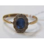 18ct YELLOW GOLD SAPPHIRE & DIAMOND RING, principal oval cut rich blue sapphire surrounded by