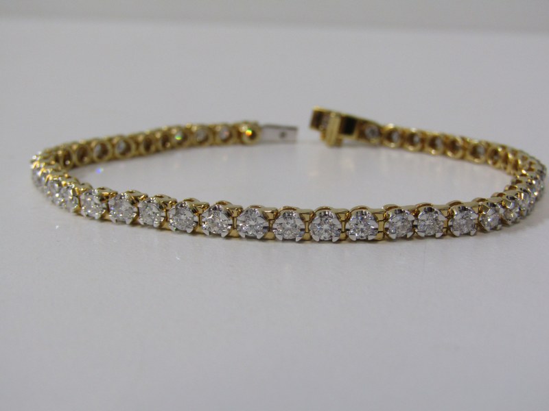 18ct YELLOW GOLD DIAMOND SET LINE BRACELET, complete with gemological science international