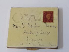 NOVELTY COMPACT in the form of stamped postal envelope addressed to Folkstone in Kent, 9cm width