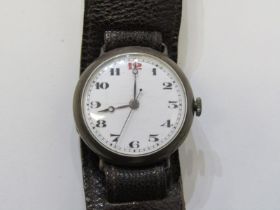 SILVER CASED TRENCH STYLE WRIST WATCH, mechanical movement, appears in working condition, on leather