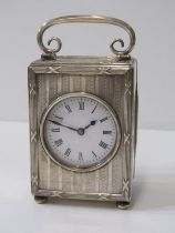 EDWARDIAN SILVER BEDROOM CLOCK, engine turned decoration with drop handle, London 1907, maker