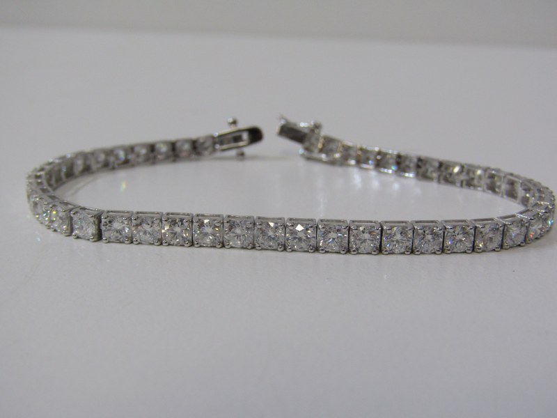 18ct WHITE GOLD DIAMOND SET LINE BRACELET, bright well matched brilliant cut diamonds, totalling