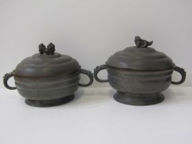 CHINESE METALWARE, a pair of Chinese pewter twin handled circular lidded serving dishes with