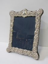 SILVER EASEL PHOTO FRAME, embossed ornate foliate border, 29cm height