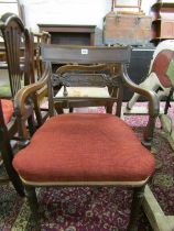LATE REGENCY MAHOGANY BAR BACK ELBOW CHAIR with carved splat and tapering ribbed legs