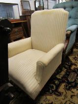 VICTORIAN UPHOLSTERED ARMCHAIR, tapering ribbed mahogany legs with original castors