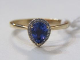 18ct YELLOW GOLD TANZANITE AND DIAMOND RING, principal pear cut tanzanite surrounded by halo of