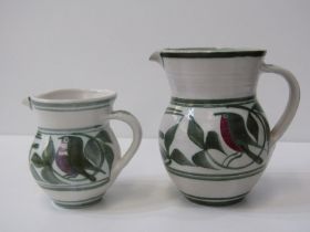 ALDERMASTON POTTERY, 2 Aldermaston pottery jugs both decorated with stylised birds within foliage.