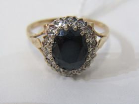 SAPPHIRE CLUSTER RING, 9ct yellow gold ring, set a large oval sapphire in a cluster, size P