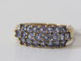 GOLD DRESS RING, 9ct yellow gold ring set 3 rows of pale blue stones possibly tanzanite size P