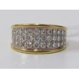 DIAMOND CLUSTER RING, a heavy 18ct yellow gold ring set with 3 rows of round brilliant cut diamonds,