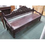 VICTORIAN CARVED MAHOGANY FRAMED SETTEE, with foliate carved panel back and front rail panel seat,