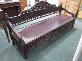 VICTORIAN CARVED MAHOGANY FRAMED SETTEE, with foliate carved panel back and front rail panel seat,