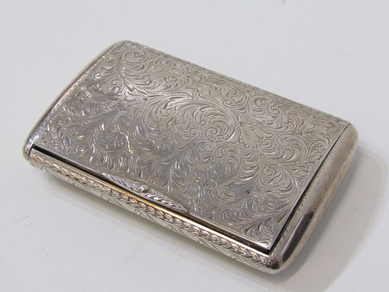 SILVER POWDER CASE, foliate decorated case of bowed form with silver gilt interior, 9cm length, 92