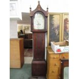 8 DAY LONG CASE CLOCK by Nelson of Market Deeping with painted arch dial, oak case with ebony