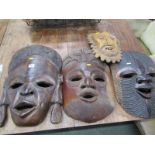 CARVED AFRICAN MASKS, 3 large carved hardwood African masks, approx 55cm, together with 1 other