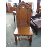 OAK GOTHIC STYLE CHAIR, with panel back and seat and pine cone finials