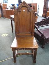 OAK GOTHIC STYLE CHAIR, with panel back and seat and pine cone finials