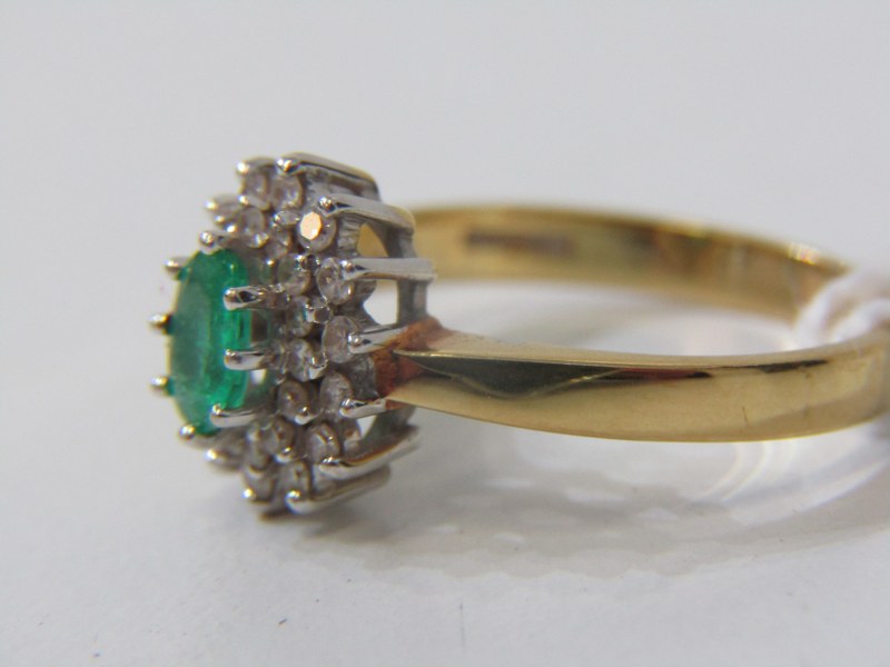 EMERALD AND DIAMOND CLUSTER RING, 18ct yellow gold ring set a central oval emerald surrounded by a - Image 2 of 4