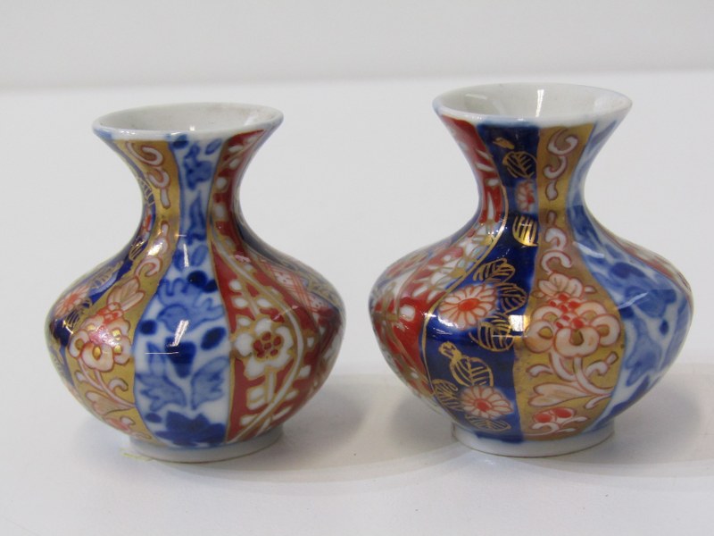 JAPANESE FUKAGAWA VASES, pair of miniature vases with alternate blue and red gilt decorated floral