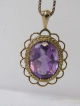 AMETHYST PENDANT, large oval cut amethyst set in 9ct gold mount, on a 9ct gold fine link necklace,