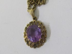 AMETHYST PENDANT, large oval amethyst set in a 9ct yellow gold mount, on 9ct gold 17" chain, 7.8