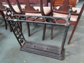 CAST IRON STICK STAND with pierced foliate panels to either side, 6 section top, 66cm width