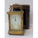 FRENCH BRASS CARRIAGE CLOCK with painted glass front panel in a pillar support case, in fitted