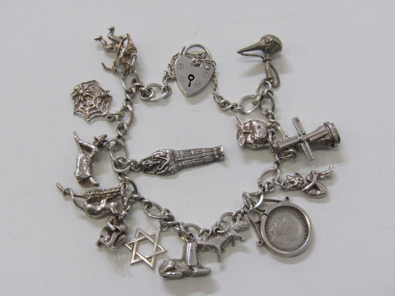 SILVER CHARM BRACELET, silver bracelet with padlock clasp with approx. 14 charms, 37.5 grams