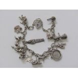 SILVER CHARM BRACELET, silver bracelet with padlock clasp with approx. 14 charms, 37.5 grams