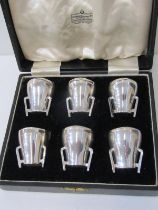 CASED SET OF 6 SPIRIT TOTS, Coombes Company Limited of Rangoon and London, 6 stylised spirit tots in