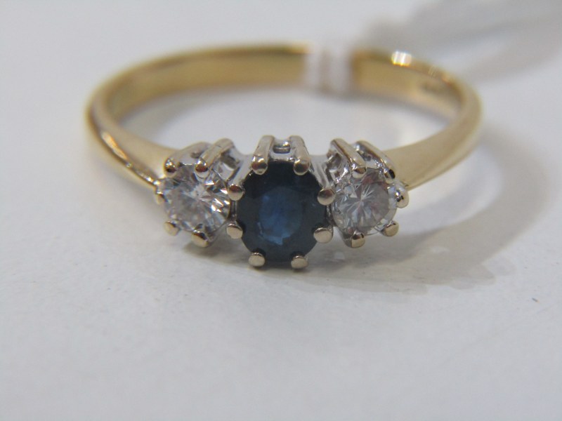 SAPPHIRE & DIAMOND 3 STONE RING, 18ct yellow gold ring set a central oval sapphire, flanked by 2
