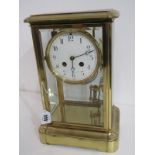 BRASS FRAMED MANTEL CLOCK, with white enamel dial, movement stamped "Made in France", no 878, with