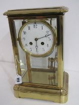 BRASS FRAMED MANTEL CLOCK, with white enamel dial, movement stamped "Made in France", no 878, with